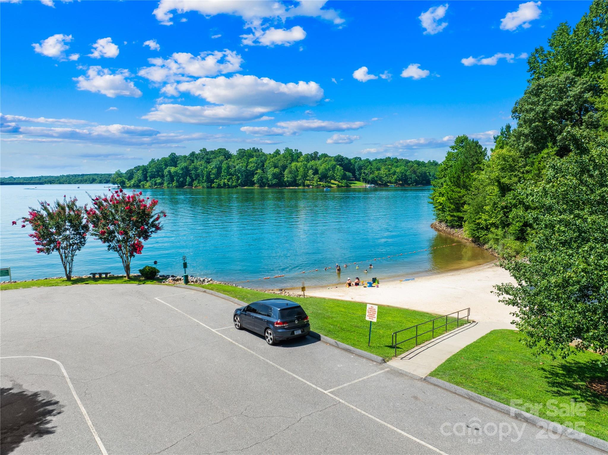145 Oak Point Lane Stony Point, NC 28678 - Photo 6 of 20 a view of a lake with a house in the background