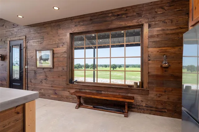 a reading room with furniture and a window