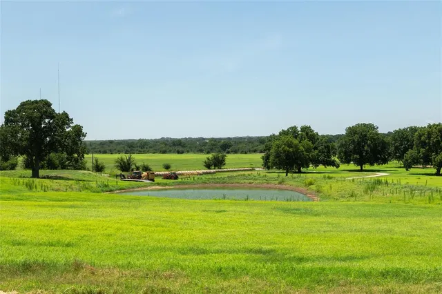 a view of a swimming pool and a yard