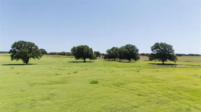 a view of a yard with swimming pool and outdoor seating