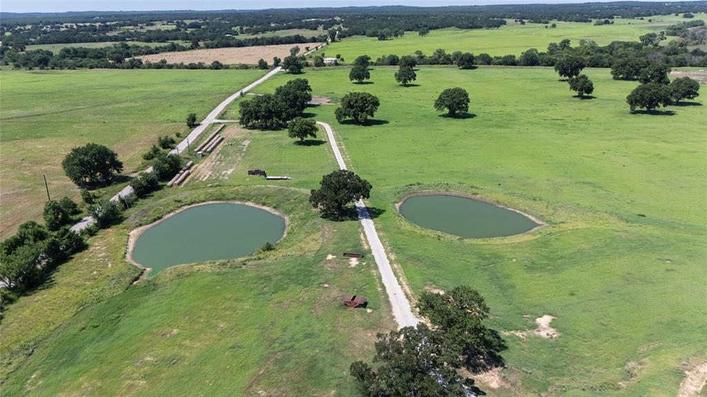 1370 Parker Dairy Road Forestburg, TX 76239 - Photo 29 of 35 an aerial view of a house with yard and lake view