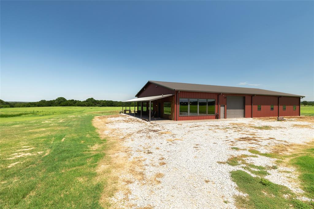 1370 Parker Dairy Road Forestburg, TX 76239 - Photo 5 of 35 a front view of a house with a garden