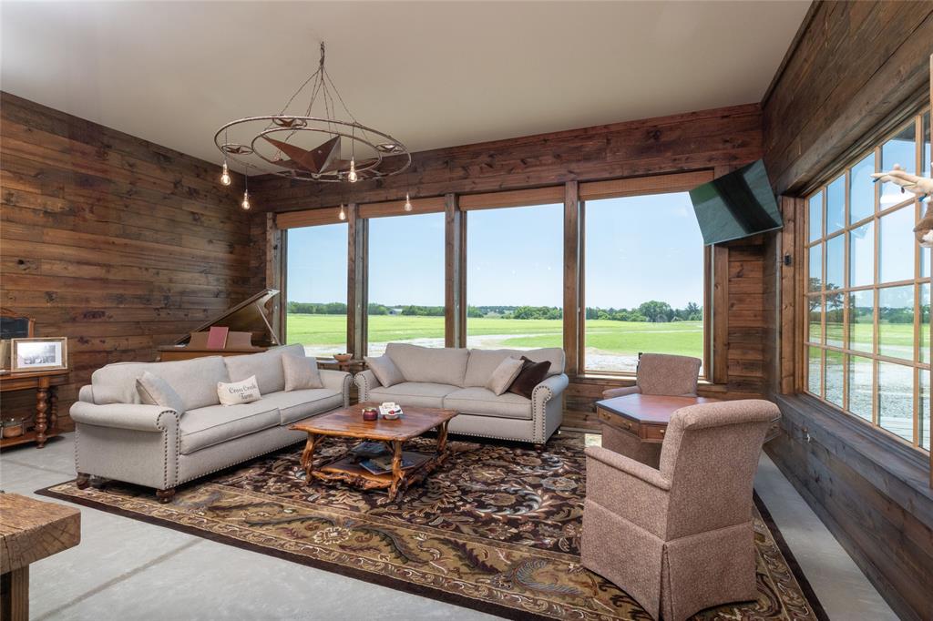 1370 Parker Dairy Road Forestburg, TX 76239 - Photo 7 of 35 a living room with furniture and a large window