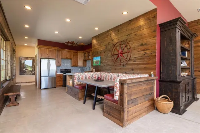 a kitchen with stainless steel appliances a refrigerator and a sink