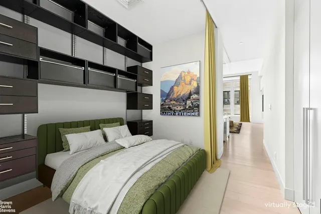 a bedroom with a bed and a walk in closet