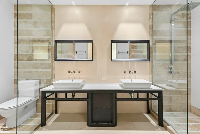a view of a bathroom with a sink and a mirror