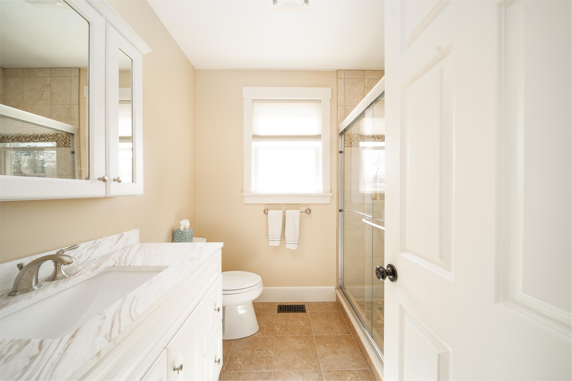 27 Watcha Path Edgartown, MA 02539 - Photo 13 of 24 a bathroom with a sink and a mirror