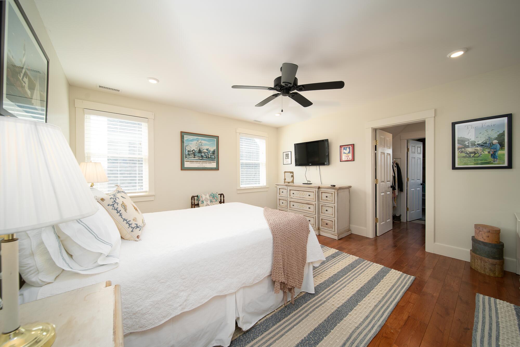 27 Watcha Path Edgartown, MA 02539 - Photo 16 of 24 a bedroom with a large bed a flat tv screen and a dresser