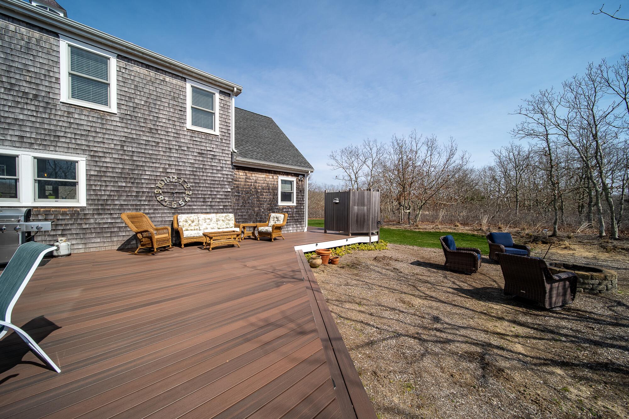 27 Watcha Path Edgartown, MA 02539 - Photo 19 of 24 a view of a backyard with sitting area