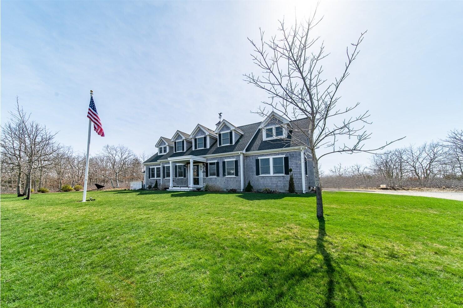 27 Watcha Path Edgartown, MA 02539 - Photo 2 of 24 a view of a house with a yard and a tree