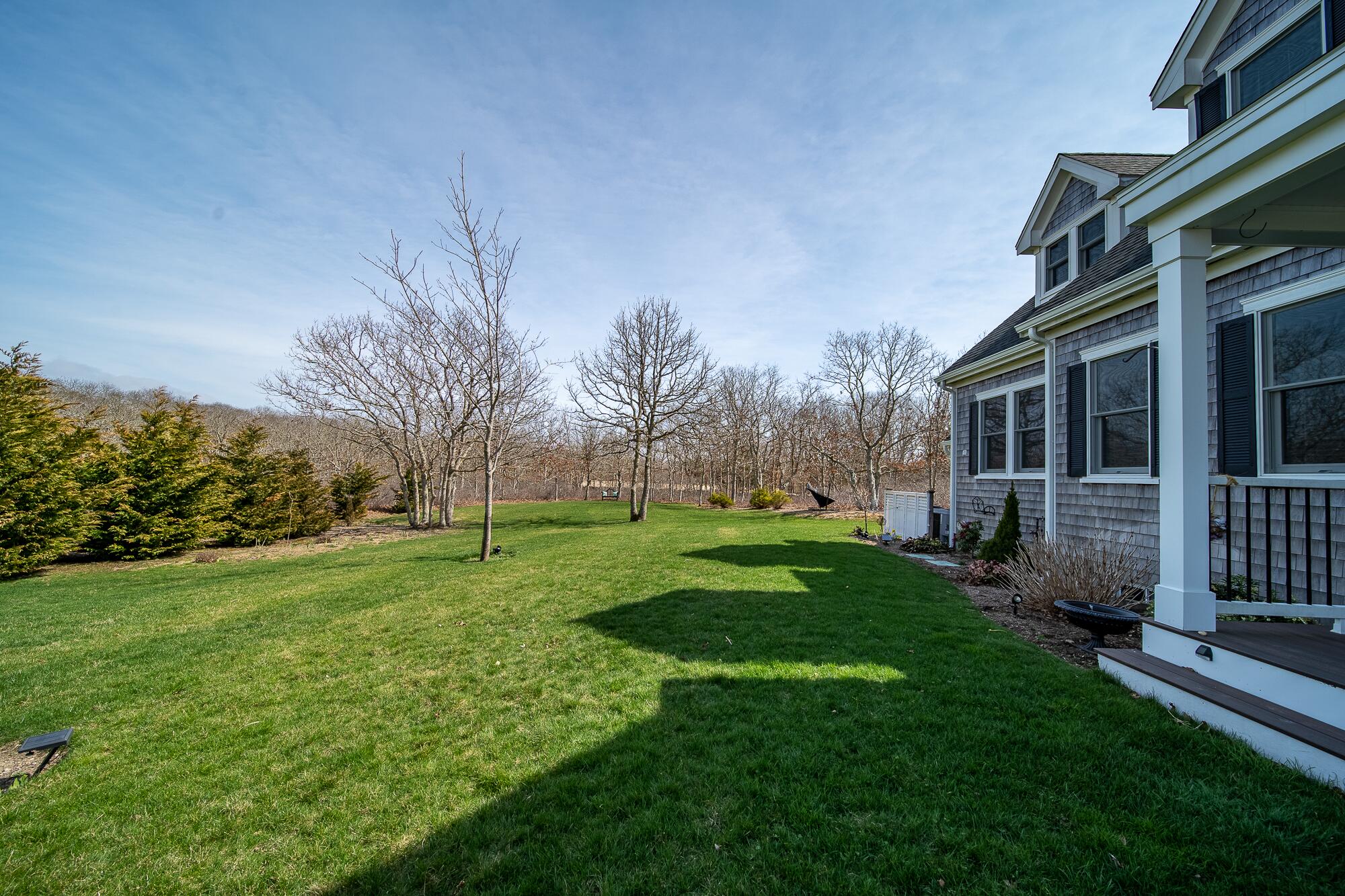 27 Watcha Path Edgartown, MA 02539 - Photo 3 of 24 a view of a house with backyard and garden