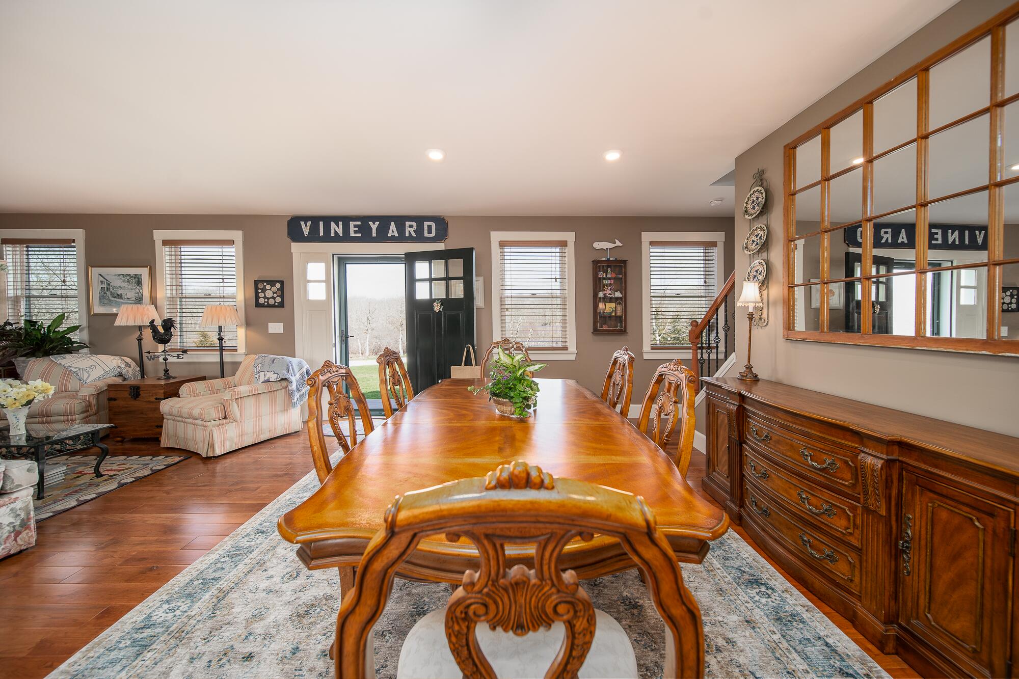 27 Watcha Path Edgartown, MA 02539 - Photo 8 of 24 a living room with furniture a wooden floor and next to windows