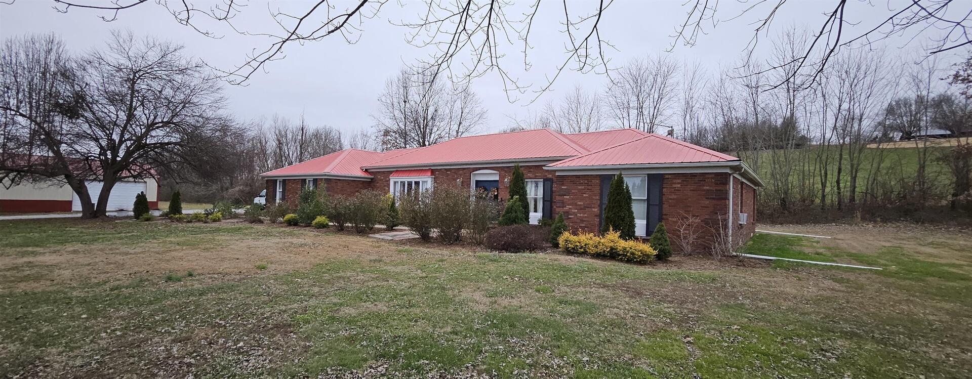 23463 Twente Crossing Road Thebes, IL 62990 - Photo 4 of 6 a view of a table and chairs under an umbrella