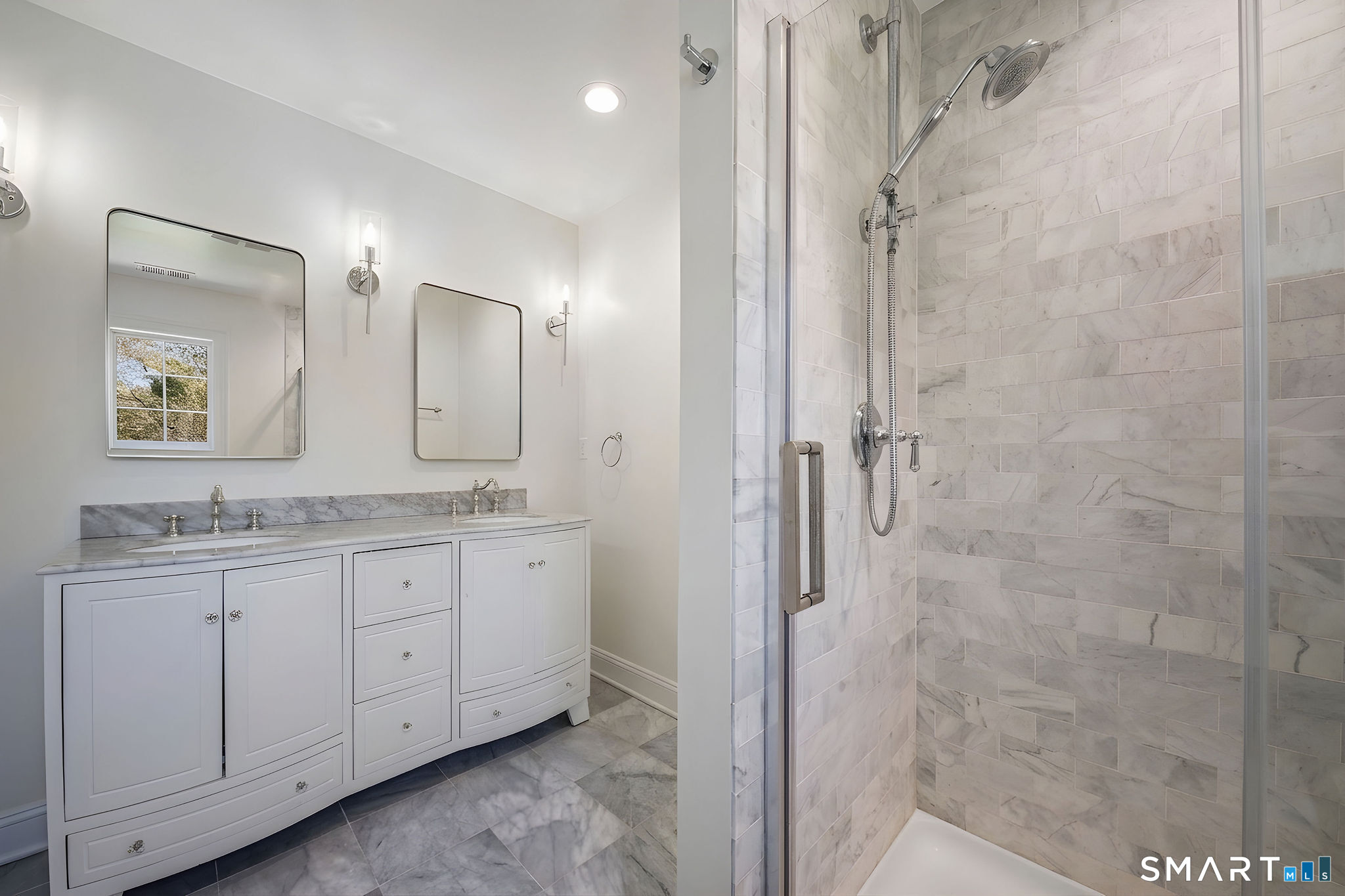 9 Sunset Ridge Drive Guilford, CT 06437 - Photo 22 of 40 a bathroom with a granite countertop sink two mirror and a shower