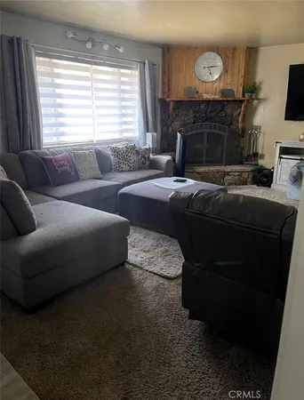 a bedroom with a bed and a fireplace