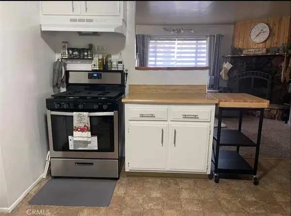 a kitchen with a stove and a refrigerator