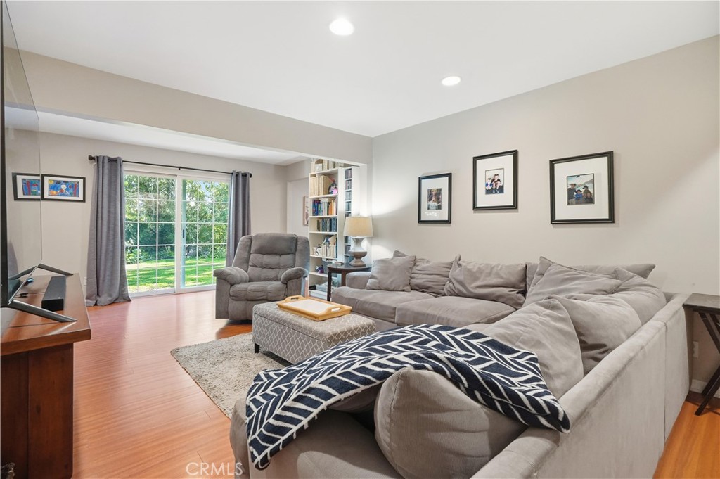 10808 Des Moines Avenue Porter Ranch, CA 91326 - Photo 12 of 39 a living room with furniture large window and a wooden floor