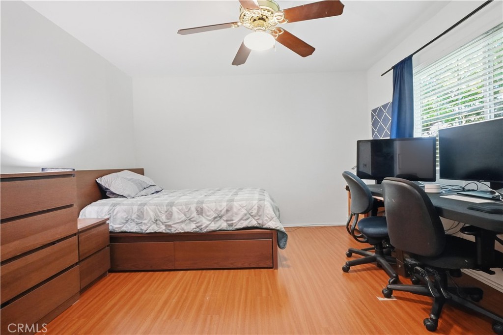 10808 Des Moines Avenue Porter Ranch, CA 91326 - Photo 13 of 39 a bedroom with a bed and a desk