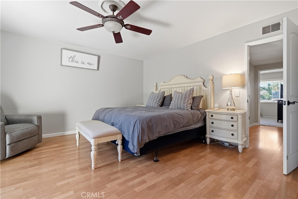 10808 Des Moines Avenue Porter Ranch, CA 91326 - Photo 19 of 39 a bedroom with a bed and furniture