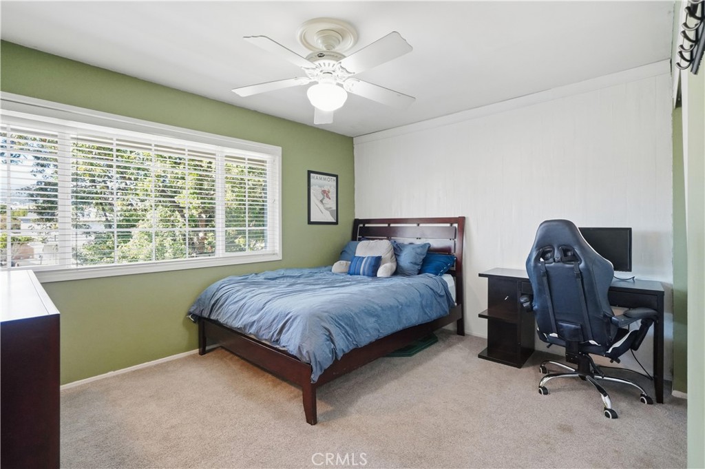 10808 Des Moines Avenue Porter Ranch, CA 91326 - Photo 24 of 39 a bed room with a bed and a window