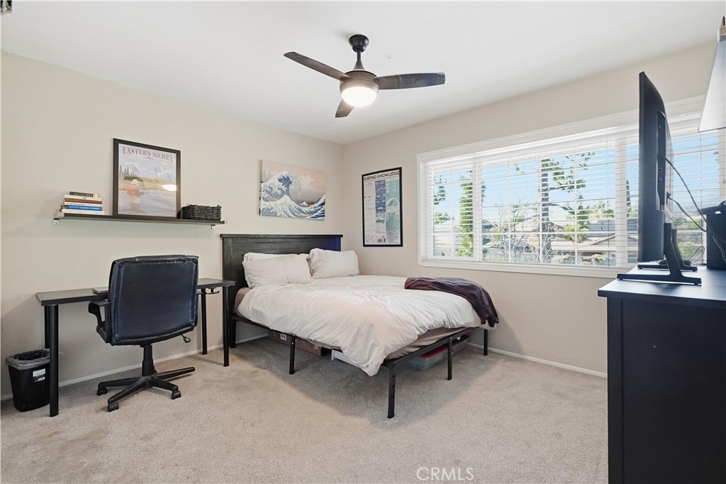 10808 Des Moines Avenue Porter Ranch, CA 91326 - Photo 25 of 39 a bedroom with a bed and a desk