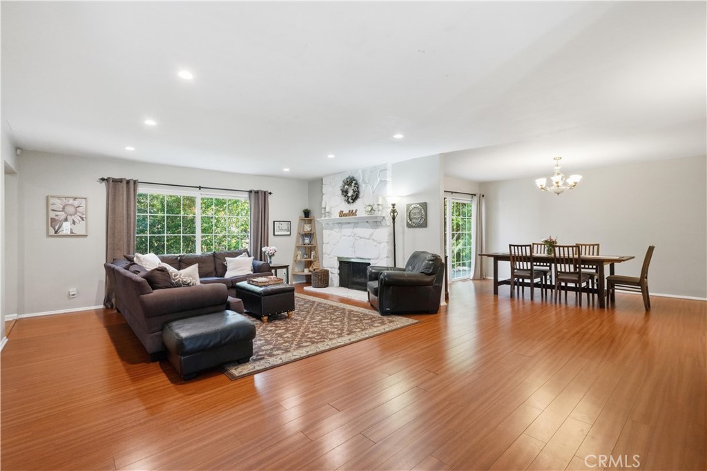 10808 Des Moines Avenue Porter Ranch, CA 91326 - Photo 3 of 39 a living room with furniture and a wooden floor