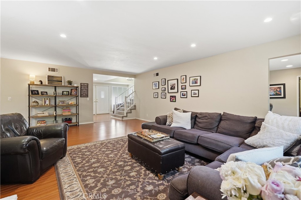 10808 Des Moines Avenue Porter Ranch, CA 91326 - Photo 37 of 39 a living room with furniture and wooden floor
