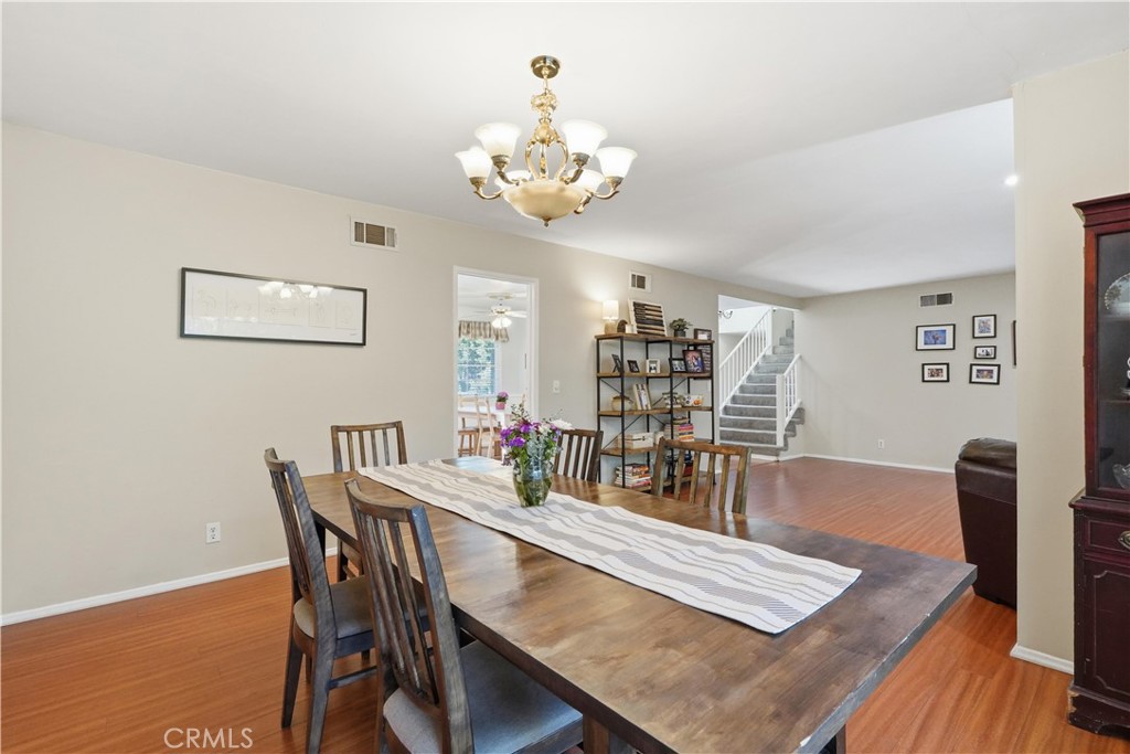 10808 Des Moines Avenue Porter Ranch, CA 91326 - Photo 38 of 39 a view of a dining room with furniture and wooden floor