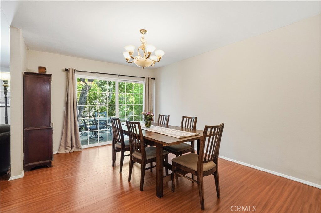 10808 Des Moines Avenue Porter Ranch, CA 91326 - Photo 5 of 39 a view of a dining room with furniture window and wooden floor