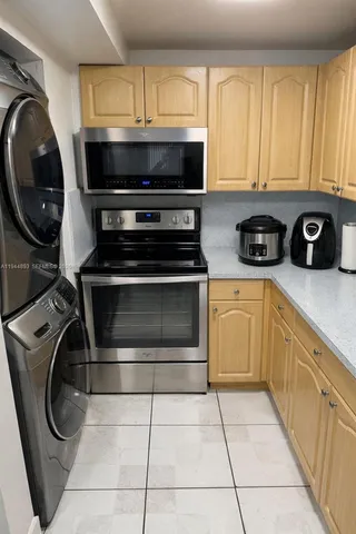 a kitchen with a stove and a microwave