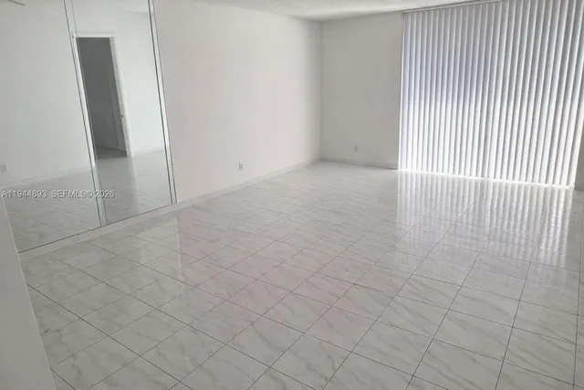 a view of an empty room and window