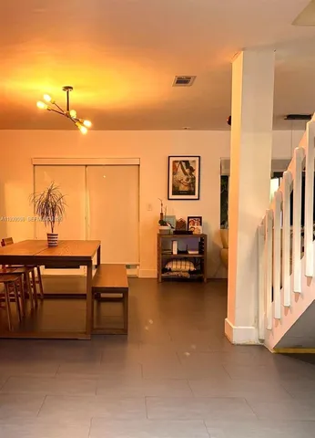 a view of a workspace with furniture and a couch