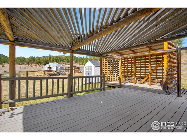 a view of balcony with wooden floor