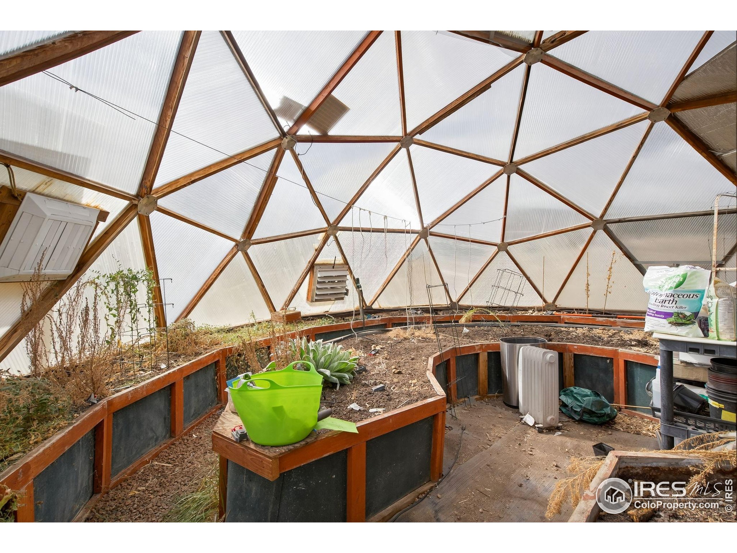 2848 Slater Creek Road Guffey, CO 80820 - Photo 27 of 50 a view of a room with wooden floor and iron stairs