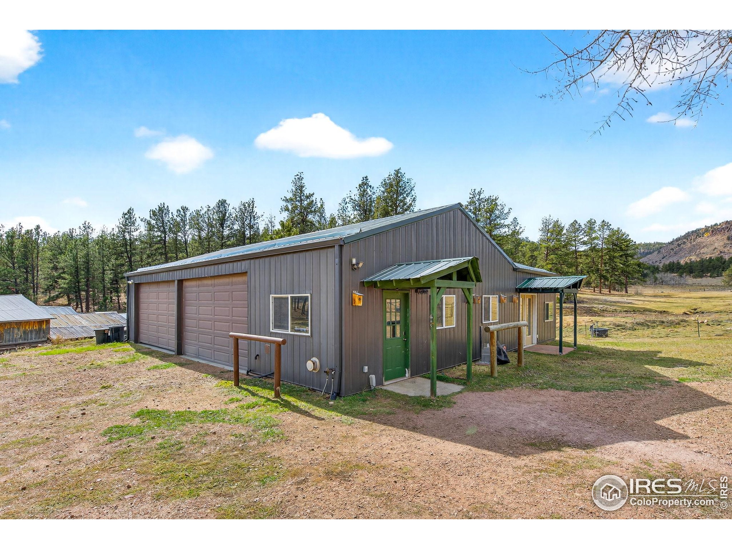 2848 Slater Creek Road Guffey, CO 80820 - Photo 28 of 50 a view of a house with a backyard