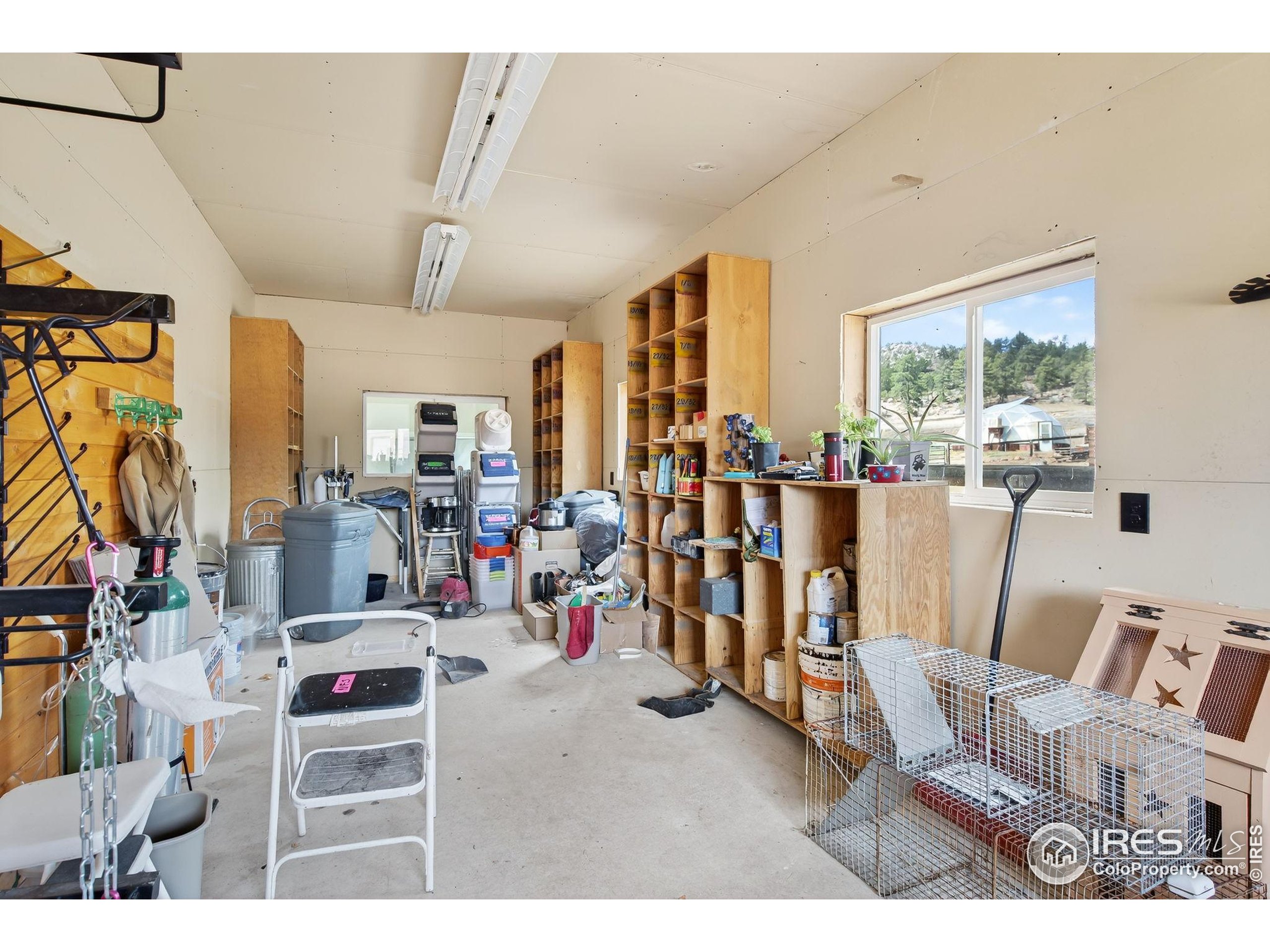 2848 Slater Creek Road Guffey, CO 80820 - Photo 29 of 50 a living room with furniture and a large window