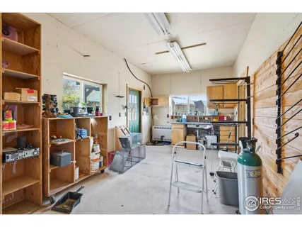 a living room with lots of furniture and clutter