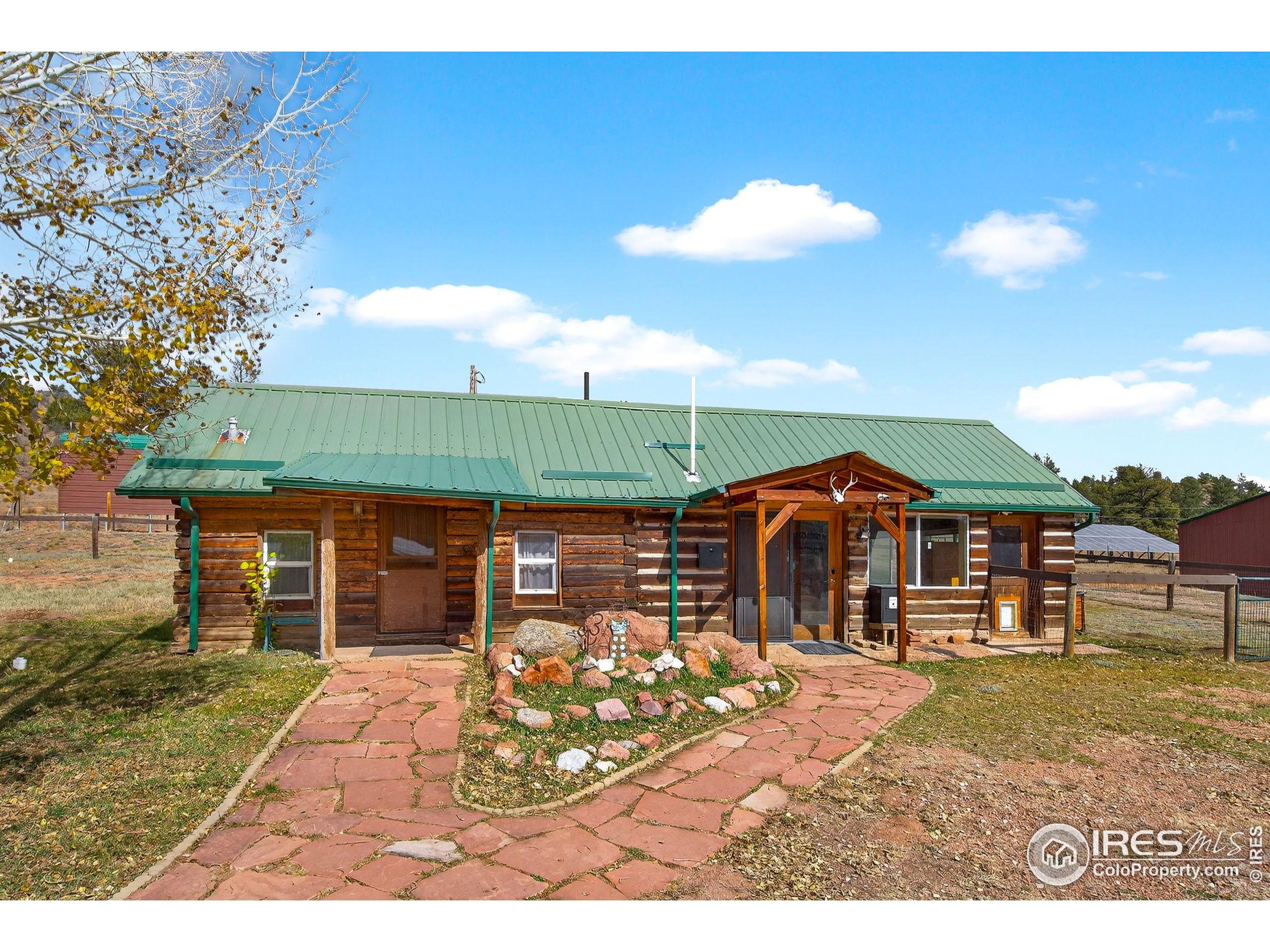 2848 Slater Creek Road Guffey, CO 80820 - Photo 38 of 50 a view of a house with a yard