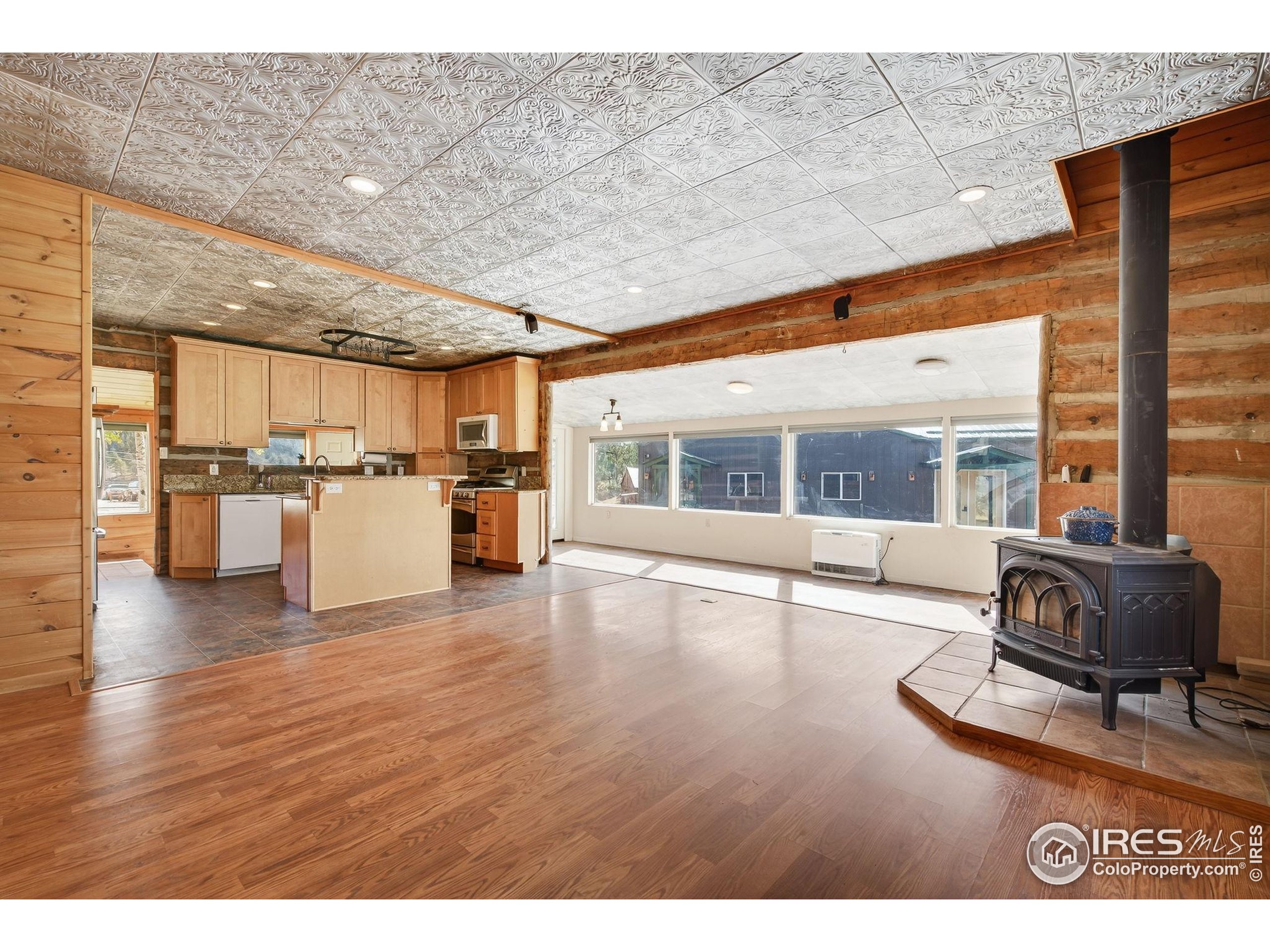 2848 Slater Creek Road Guffey, CO 80820 - Photo 8 of 50 a living room with furniture and kitchen view