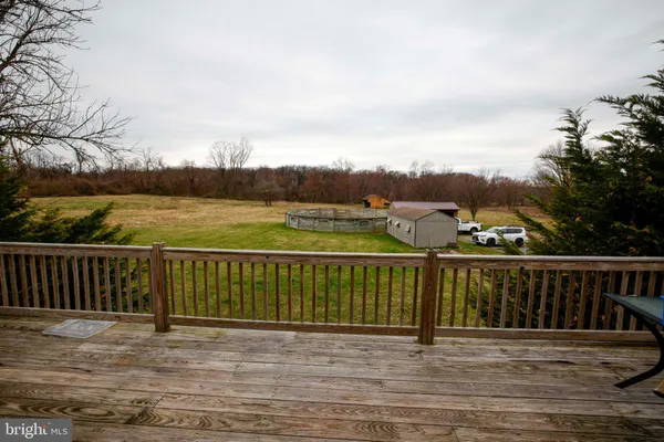 a view of a backyard with sitting area