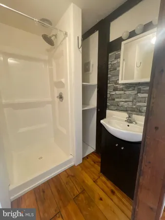 a view of room with window and hardwood floor