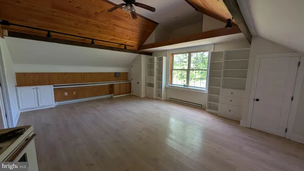 a kitchen with a sink appliances cabinets and a counter top space