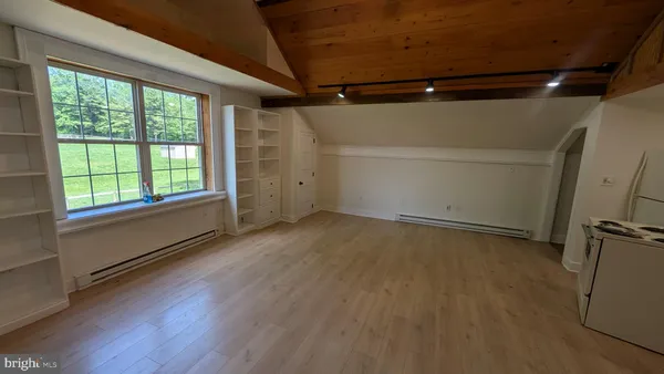 a kitchen with a refrigerator stove and microwave