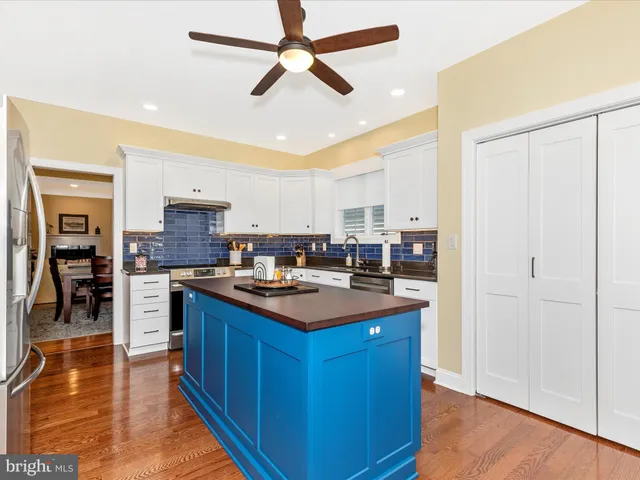 a kitchen with stainless steel appliances a stove a sink dishwasher and a refrigerator