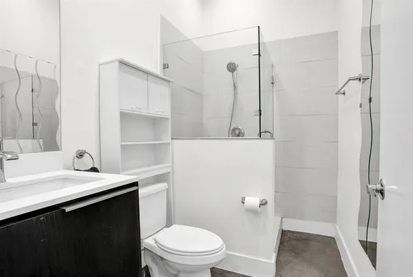 a view of a livingroom with furniture and hardwood floor