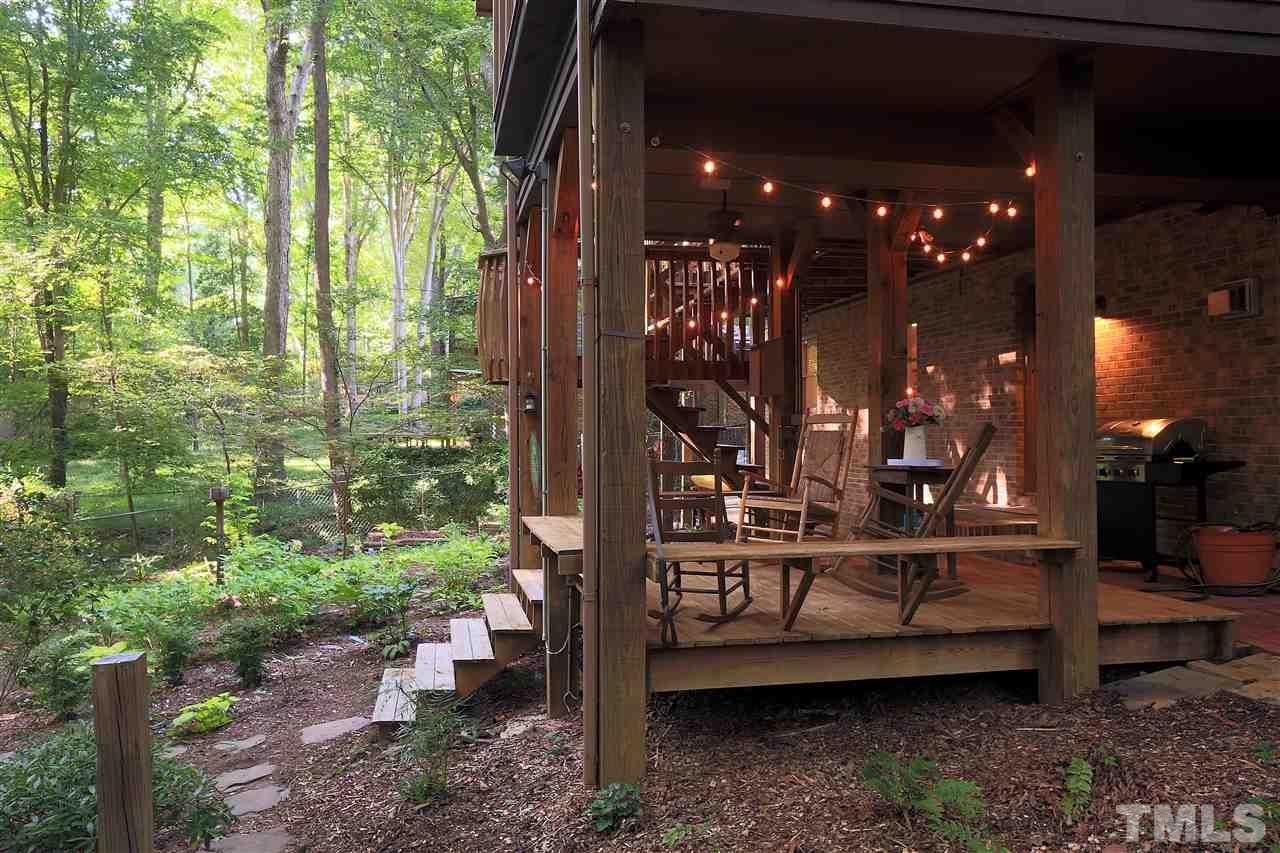 4921 Oak Park Road Raleigh, NC 27612 - Photo 22 of 25 a view of a balcony with lots of green space