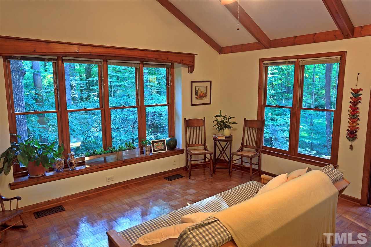 4921 Oak Park Road Raleigh, NC 27612 - Photo 8 of 25 a living room filled with furniture and floor to ceiling window