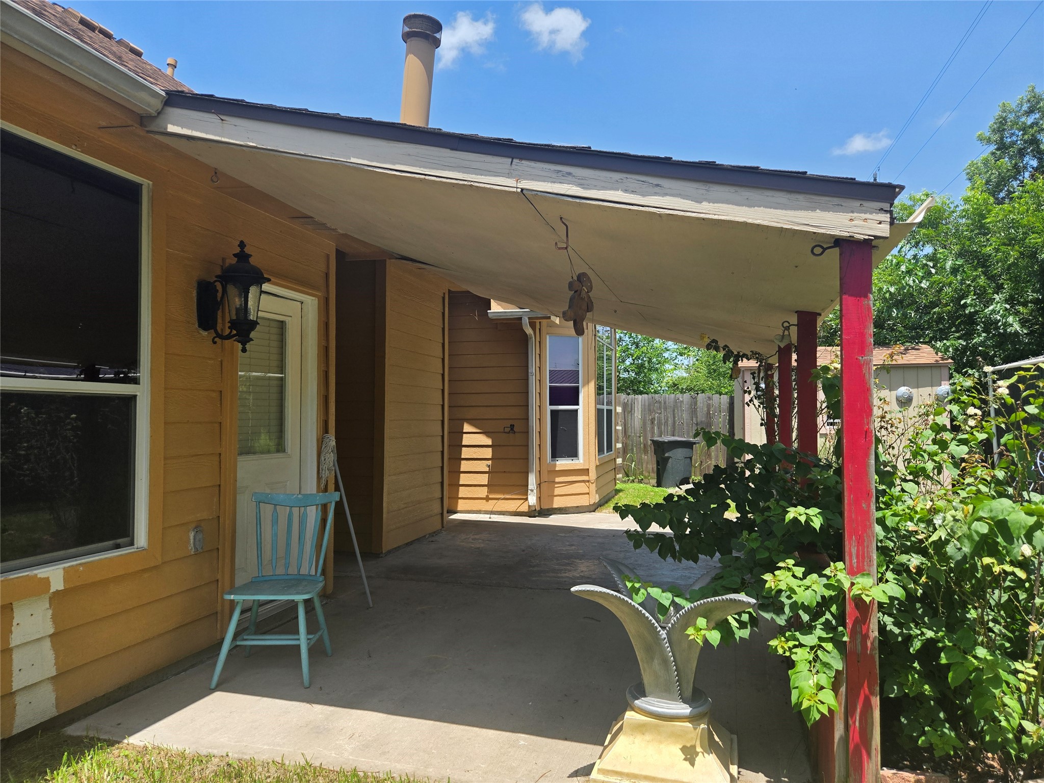 3818 Ridge Canyon Road Baytown, TX 77521 - Photo 26 of 32 a porch with a table and chairs