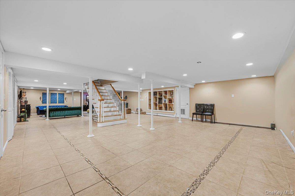 626 Caledonia Road Dix Hills, NY 11746 - Photo 10 of 49 a view of an empty room with stairs