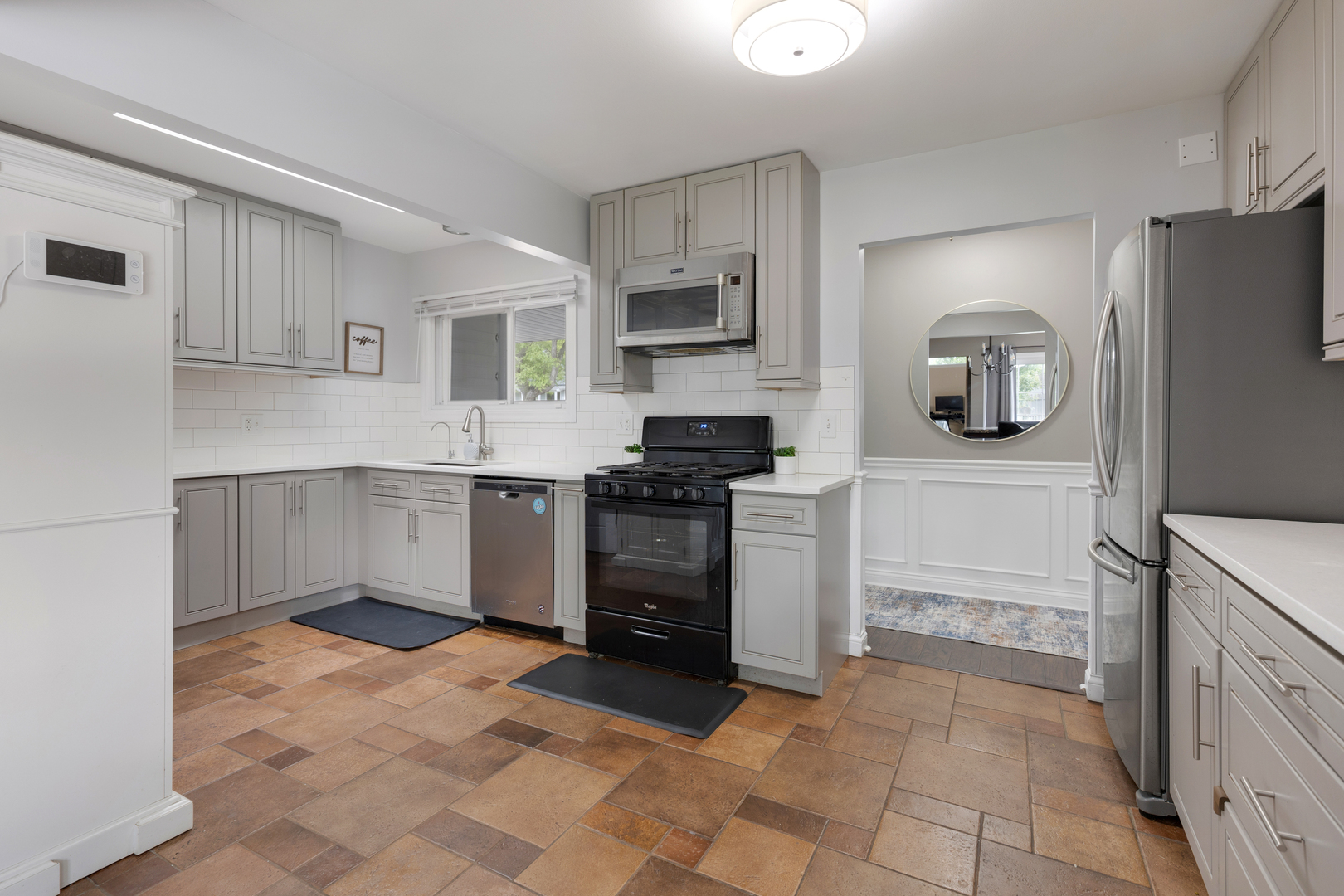 1850 Pierce Road Hoffman Estates, IL 60169 - Photo 11 of 25 a kitchen with a refrigerator sink and cabinets